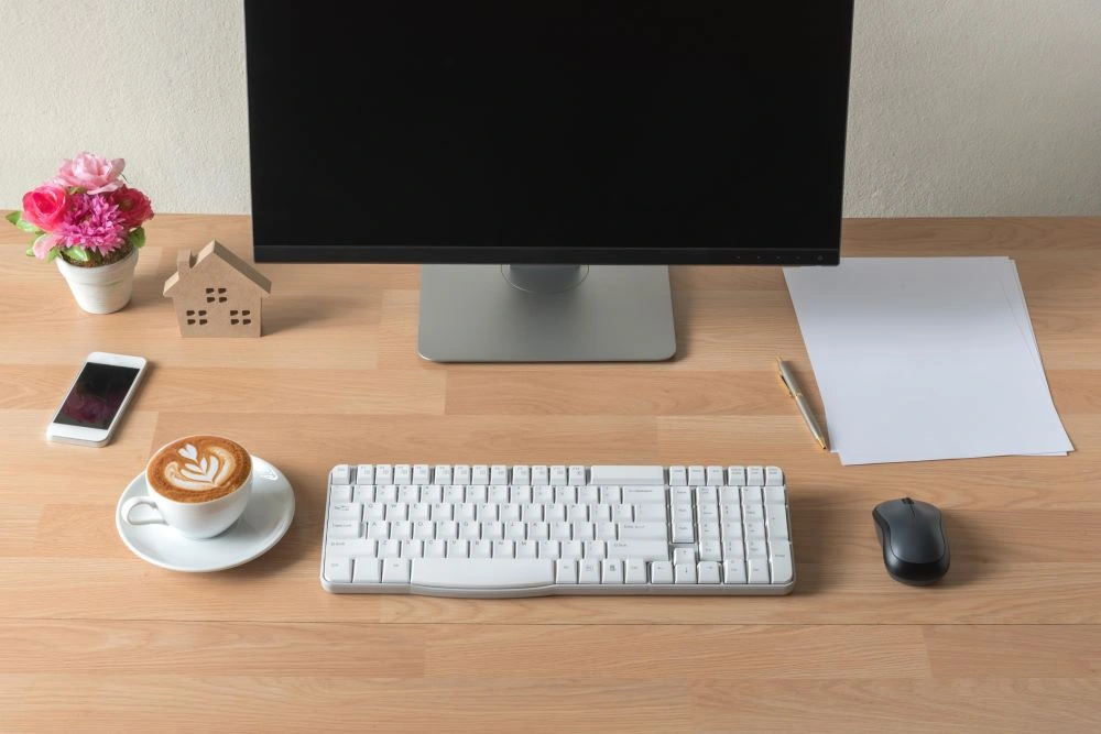 Height-adjustable electric standing desk and ergonomic chair